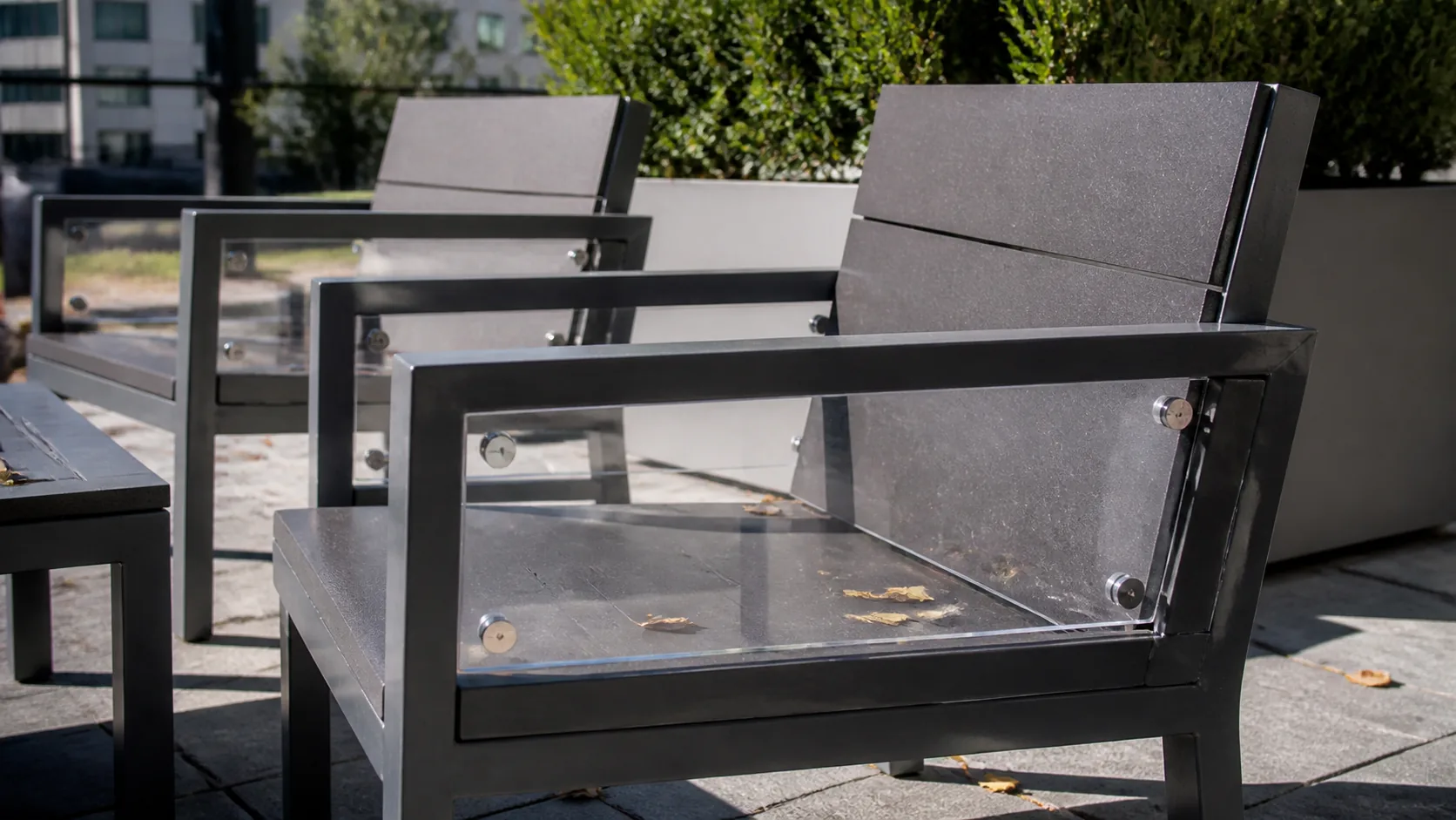 Clear polycarbonate panel in an impact-prone outdoor chair detail